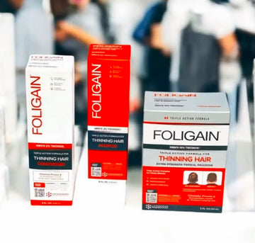شامبو وبلسم وعلاج موضعي من FOLIGAIN TRIOXIDIL للرجال في علب برتقالية وبيضاء.