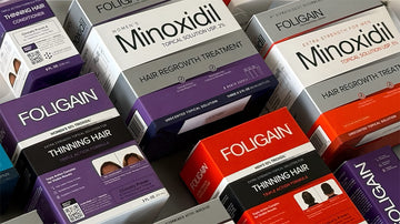 تشكيلة من منتجات FOLIGAIN للعناية بالشعر بالمينوكسيديل وTRIOXIDIL في علب.